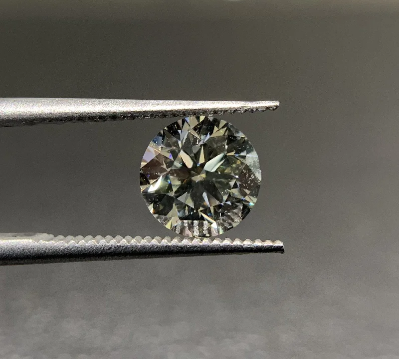 Men's Tanzanite Engagement Rings in Palladium with a Three - Stone ArrangementRound Brilliant Loose Diamond .90ct H/VS2 | Mullen Jewelers Men's Tanzanite Engagement Rings in Palladium with a Three - Stone ArrangementRound Brilliant Loose Diamond .90ct H/VS2 | Mullen Jewelers