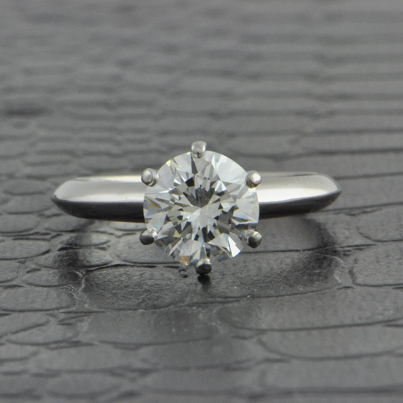 Aquamarine and diamond engagement ring in a 18K white - gold setting with a scalloped edgeTiffany & Co. 1.53 ct. Round Brilliant Cut Diamond Engagement Ring Aquamarine and diamond engagement ring in a 18K white - gold setting with a scalloped edgeTiffany & Co. 1.53 ct. Round Brilliant Cut Diamond Engagement Ring