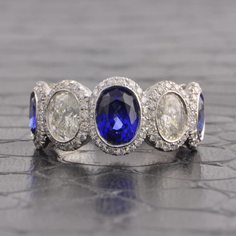 Oval - cut sapphire and diamond engagement ring in 18K white goldSapphire and Diamond Band in Platinum Oval - cut sapphire and diamond engagement ring in 18K white goldSapphire and Diamond Band in Platinum