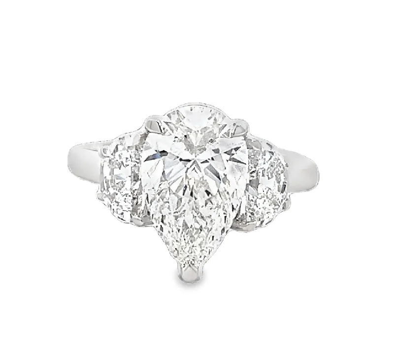 Ruby and diamond engagement ring with a halo of diamonds in 14K red goldLAB GROWN PEAR & TRAPEZOID DIAMONDS 3.72ctw THREE STONE RING Ruby and diamond engagement ring with a halo of diamonds in 14K red goldLAB GROWN PEAR & TRAPEZOID DIAMONDS 3.72ctw THREE STONE RING
