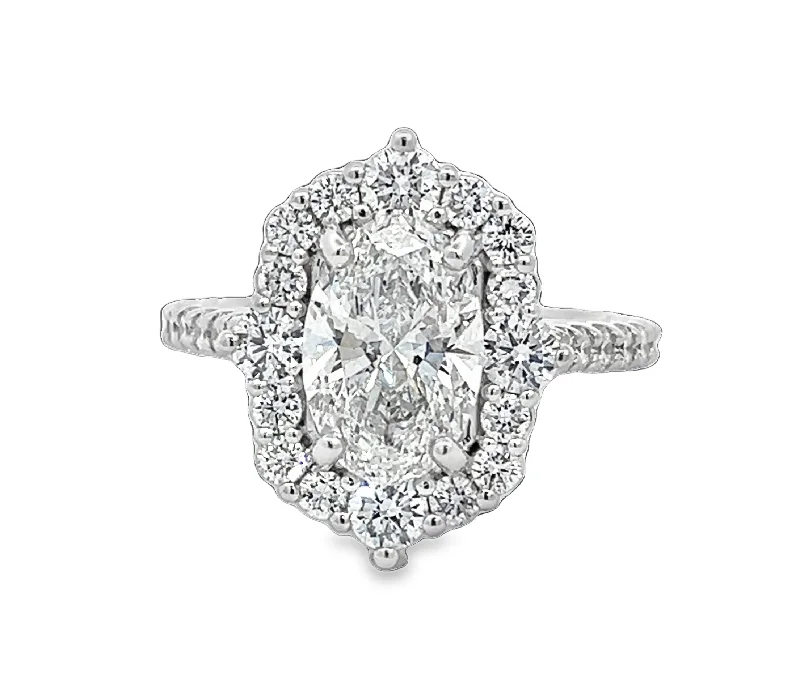 Three - stone diamond engagement ring in rose gold, symbolizing past, present, and futureLAB GROWN OVAL & ROUND DIAMONDS 3.52ctw ANTIQUE HALO RING Three - stone diamond engagement ring in rose gold, symbolizing past, present, and futureLAB GROWN OVAL & ROUND DIAMONDS 3.52ctw ANTIQUE HALO RING