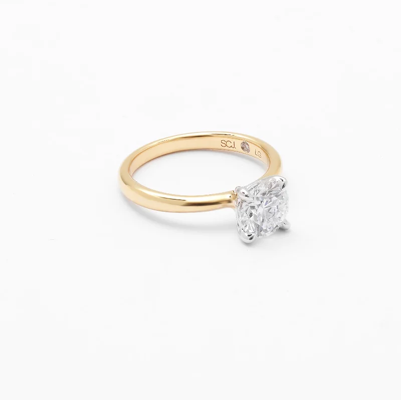Emerald - cut diamond engagement ring set in a modern titanium band18K Yellow And White Gold Round Brilliant Lab Diamond Solitaire Engagement Ring 1.5ct Emerald - cut diamond engagement ring set in a modern titanium band18K Yellow And White Gold Round Brilliant Lab Diamond Solitaire Engagement Ring 1.5ct