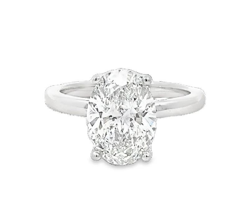 Halo diamond engagement ring in 18K white gold with a center oval - cut stoneLAB GROWN OVAL & ROUND DIAMONDS 3.16ctw SOLITAIRE RING Halo diamond engagement ring in 18K white gold with a center oval - cut stoneLAB GROWN OVAL & ROUND DIAMONDS 3.16ctw SOLITAIRE RING