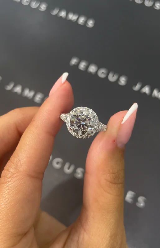 Solitaire diamond engagement ring with a platinum setting for a classic and elegant look2.5 Carat Lab-Grown Halo Engagement Ring - Round Diamond in 18k White Gold Setting