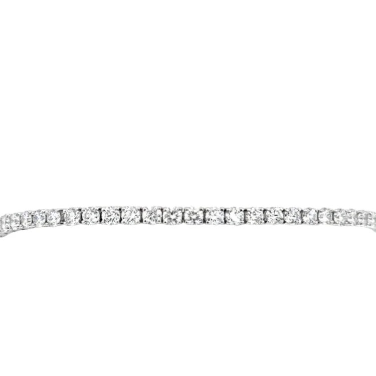 Aquamarine and diamond engagement ring in a 18K white - gold setting with a scalloped edgeLAB GROWN ROUND DIAMONDS 4.11CTW TENNIS BRACELET Aquamarine and diamond engagement ring in a 18K white - gold setting with a scalloped edgeLAB GROWN ROUND DIAMONDS 4.11CTW TENNIS BRACELET