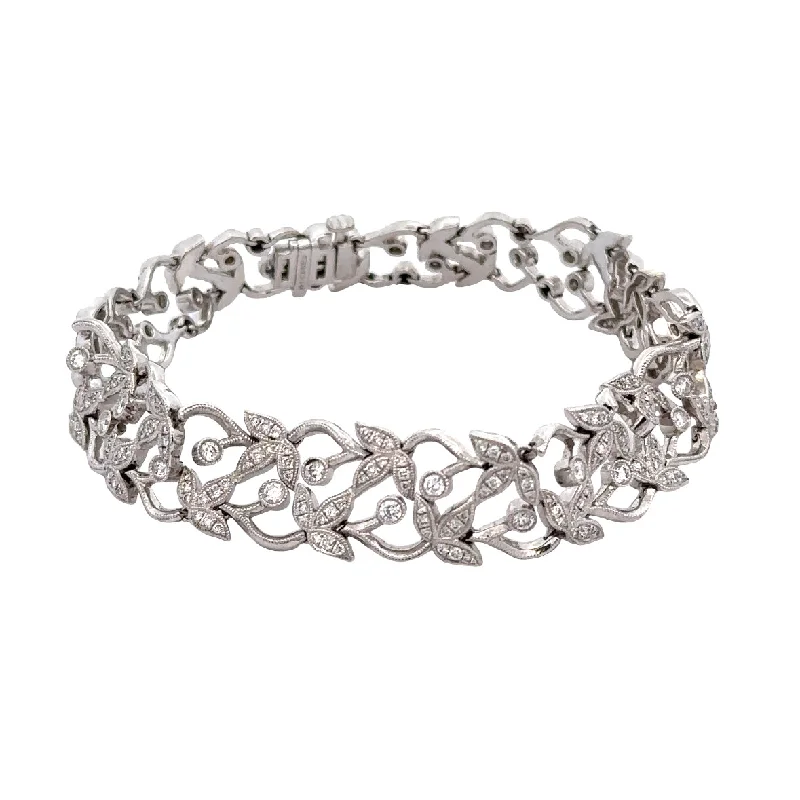 Opal and diamond engagement ring in a contemporary silver band with black - rhodium accentsOpenwork Diamond Foliate Style Bracelet in WHite Gold Opal and diamond engagement ring in a contemporary silver band with black - rhodium accentsOpenwork Diamond Foliate Style Bracelet in WHite Gold