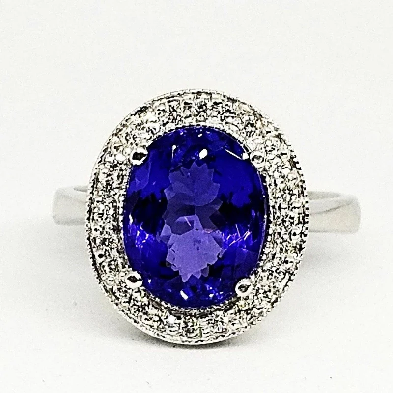 Engagement - Inspired Women's Rings with a Halo of Small Diamonds18kt White Gold Halo Oval Tanzanite Ring with Diamonds Engagement - Inspired Women's Rings with a Halo of Small Diamonds18kt White Gold Halo Oval Tanzanite Ring with Diamonds