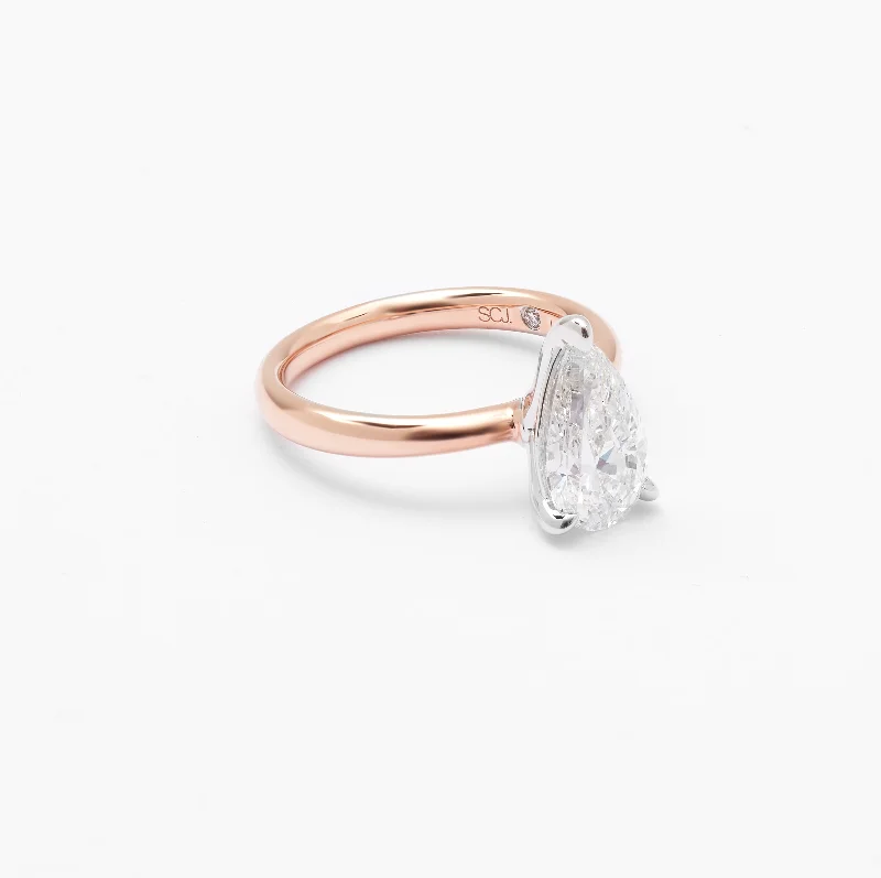 Emerald - cut diamond engagement ring set in a modern titanium band14K Rose And White Gold Pear Lab Diamond Solitaire Engagement Ring 2.0ct Emerald - cut diamond engagement ring set in a modern titanium band14K Rose And White Gold Pear Lab Diamond Solitaire Engagement Ring 2.0ct