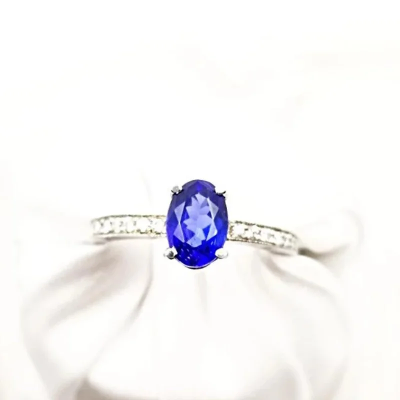 Floral - Patterned Women's Rings in 18K Yellow Gold for a Feminine LookWhite Gold Oval Tanzanite and Diamond Ring Floral - Patterned Women's Rings in 18K Yellow Gold for a Feminine LookWhite Gold Oval Tanzanite and Diamond Ring
