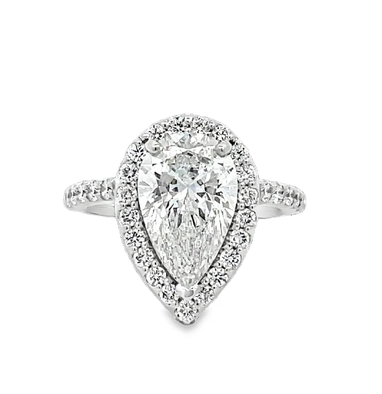 Radiant - cut diamond engagement ring with a bezel - set center stone in 18K yellow goldLAB GROWN PEAR & ROUND DIAMONDS 3.7ctw HALO RING Radiant - cut diamond engagement ring with a bezel - set center stone in 18K yellow goldLAB GROWN PEAR & ROUND DIAMONDS 3.7ctw HALO RING