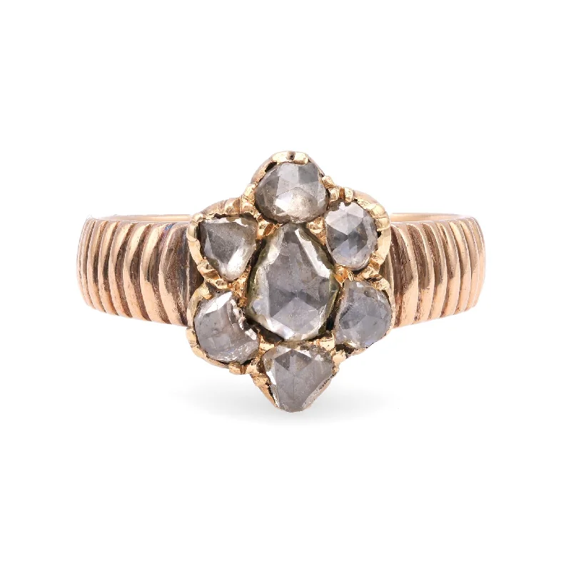 Pear - shaped diamond engagement ring with side baguette diamonds in 18K goldOne Antique Austro-Hungarian Diamond 14k Rose Gold Cluster Ring Pear - shaped diamond engagement ring with side baguette diamonds in 18K goldOne Antique Austro-Hungarian Diamond 14k Rose Gold Cluster Ring