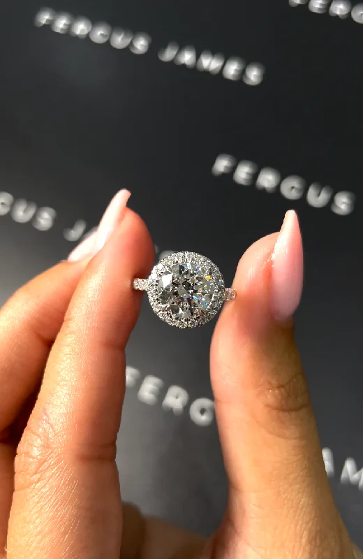 Oval - cut sapphire and diamond engagement ring in 18K white gold2 Carat Natural Halo Engagement Ring - Round Diamond in 18k White Gold Setting Oval - cut sapphire and diamond engagement ring in 18K white gold2 Carat Natural Halo Engagement Ring - Round Diamond in 18k White Gold Setting