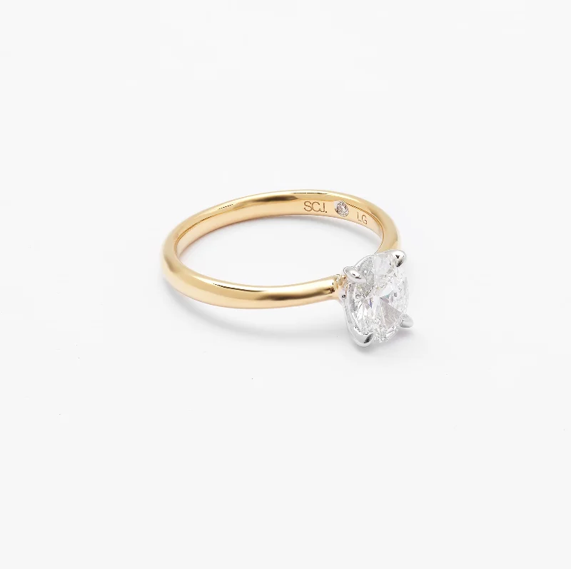 Pink diamond engagement ring in a rose - gold band with white - gold accents18K Yellow And White Gold Oval Lab Diamond Solitaire Engagement Ring 1.0ct Pink diamond engagement ring in a rose - gold band with white - gold accents18K Yellow And White Gold Oval Lab Diamond Solitaire Engagement Ring 1.0ct