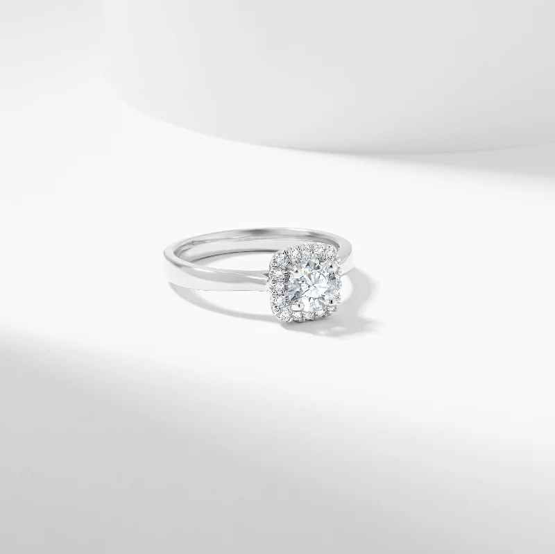 Three - stone diamond engagement ring in rose gold, symbolizing past, present, and futureRound Brilliant Moissanite Halo Engagement Ring 0.73tdw Three - stone diamond engagement ring in rose gold, symbolizing past, present, and futureRound Brilliant Moissanite Halo Engagement Ring 0.73tdw
