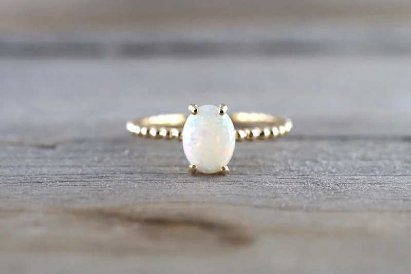 Men's emerald - encrusted rings for a rich green tone14k Yellow Gold Fire Opal Oval Shape Ring Bead Rope Design Men's emerald - encrusted rings for a rich green tone14k Yellow Gold Fire Opal Oval Shape Ring Bead Rope Design