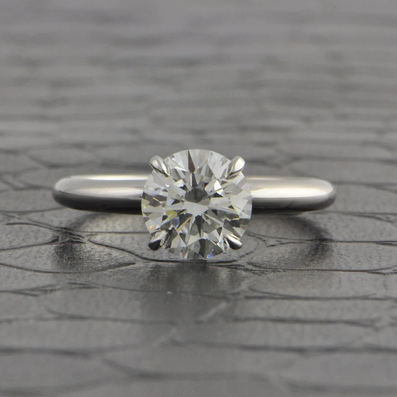 Radiant - cut diamond engagement ring with a bezel - set center stone in 18K yellow goldGIA 2.0 ct. H-VS1 Round Brilliant Cut Diamond Engagement Ring Radiant - cut diamond engagement ring with a bezel - set center stone in 18K yellow goldGIA 2.0 ct. H-VS1 Round Brilliant Cut Diamond Engagement Ring