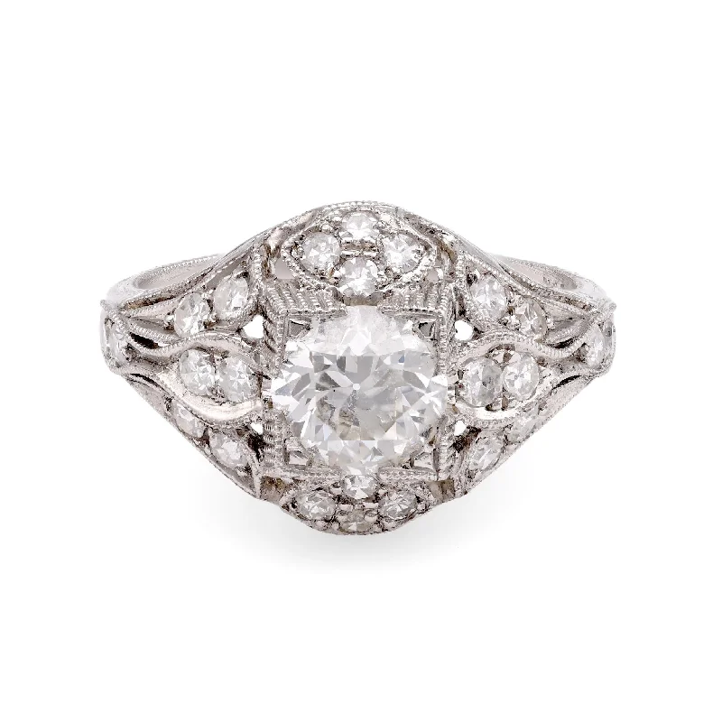 Halo diamond engagement ring in 18K white gold with a center oval - cut stoneEdwardian-Inspired Diamond Ring Halo diamond engagement ring in 18K white gold with a center oval - cut stoneEdwardian-Inspired Diamond Ring