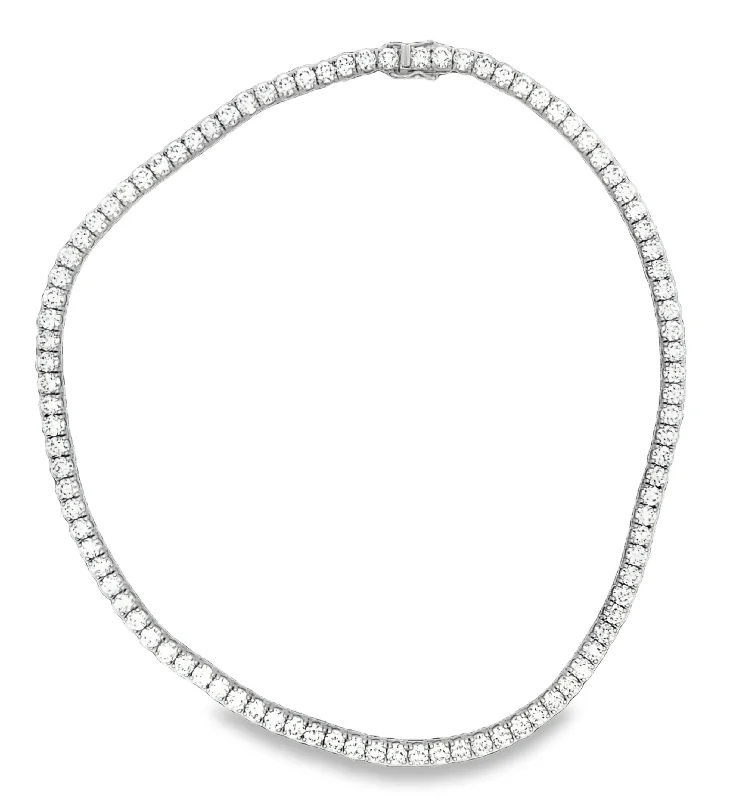 Ruby and diamond engagement ring with a halo of diamonds in 14K red goldLAB GROWN ROUND DIAMONDS 30.00CTW TENNIS NECKLACE Ruby and diamond engagement ring with a halo of diamonds in 14K red goldLAB GROWN ROUND DIAMONDS 30.00CTW TENNIS NECKLACE