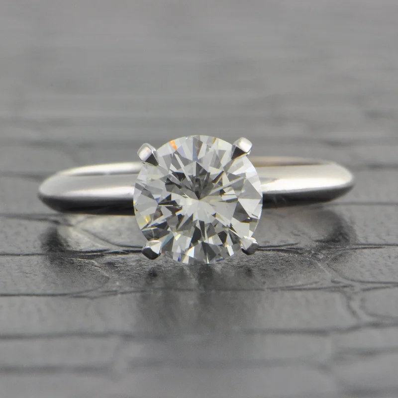 Aquamarine and diamond engagement ring in a 18K white - gold setting with a scalloped edgeGIA 1.50 ct. Round Brilliant Cut Diamond Engagement Ring in White Gold Aquamarine and diamond engagement ring in a 18K white - gold setting with a scalloped edgeGIA 1.50 ct. Round Brilliant Cut Diamond Engagement Ring in White Gold