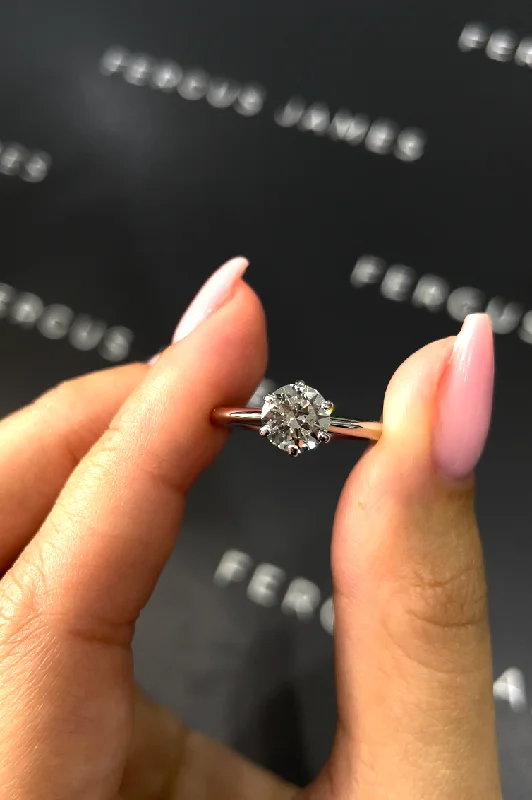 Emerald - cut diamond engagement ring set in a modern titanium band1 Carat Natural Solitaire Engagement Ring - Round Diamond in 18k White Gold Setting Emerald - cut diamond engagement ring set in a modern titanium band1 Carat Natural Solitaire Engagement Ring - Round Diamond in 18k White Gold Setting