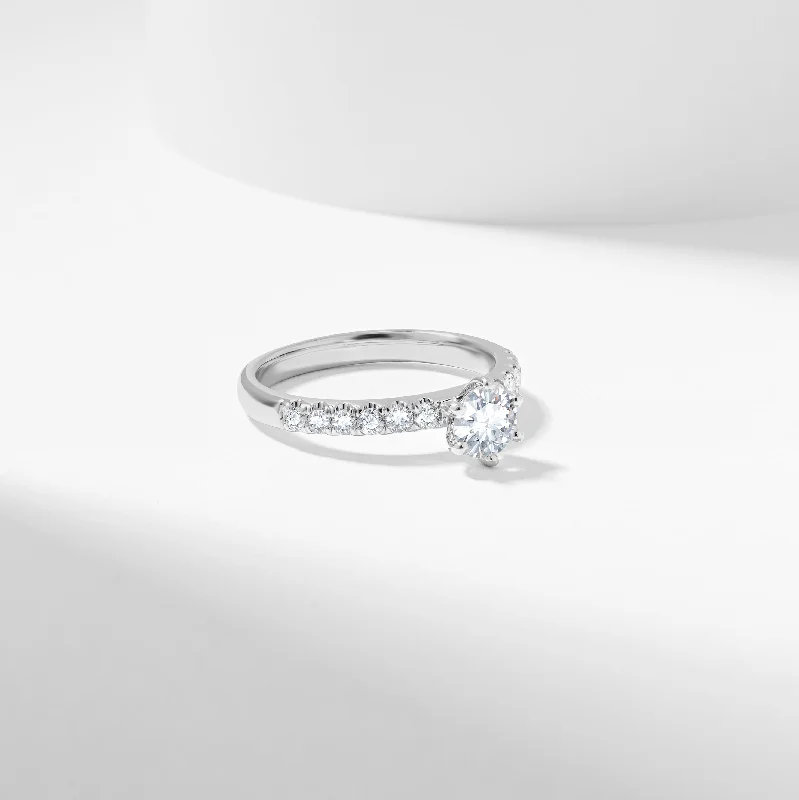 Radiant - cut diamond engagement ring with a bezel - set center stone in 18K yellow goldRound Brilliant Diamond Solitaire with Shoulder Accents Engagement Ring 1.0tdw Radiant - cut diamond engagement ring with a bezel - set center stone in 18K yellow goldRound Brilliant Diamond Solitaire with Shoulder Accents Engagement Ring 1.0tdw