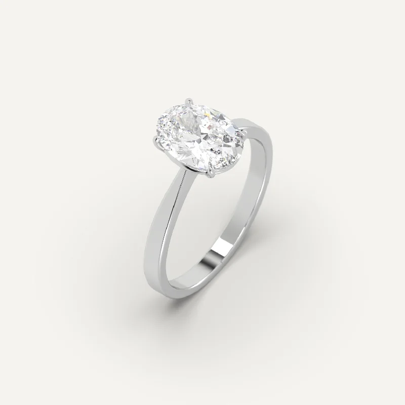 Men's Tanzanite Engagement Rings in Palladium with a Three - Stone Arrangement2 carat Oval Cut Diamond Ring Men's Tanzanite Engagement Rings in Palladium with a Three - Stone Arrangement2 carat Oval Cut Diamond Ring