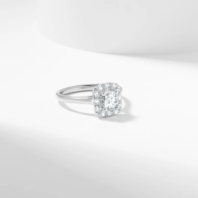 Round - cut diamond engagement ring with a twisted band design in 14K white goldCushion Moissanite Halo Engagement Ring 1.1tdw Round - cut diamond engagement ring with a twisted band design in 14K white goldCushion Moissanite Halo Engagement Ring 1.1tdw