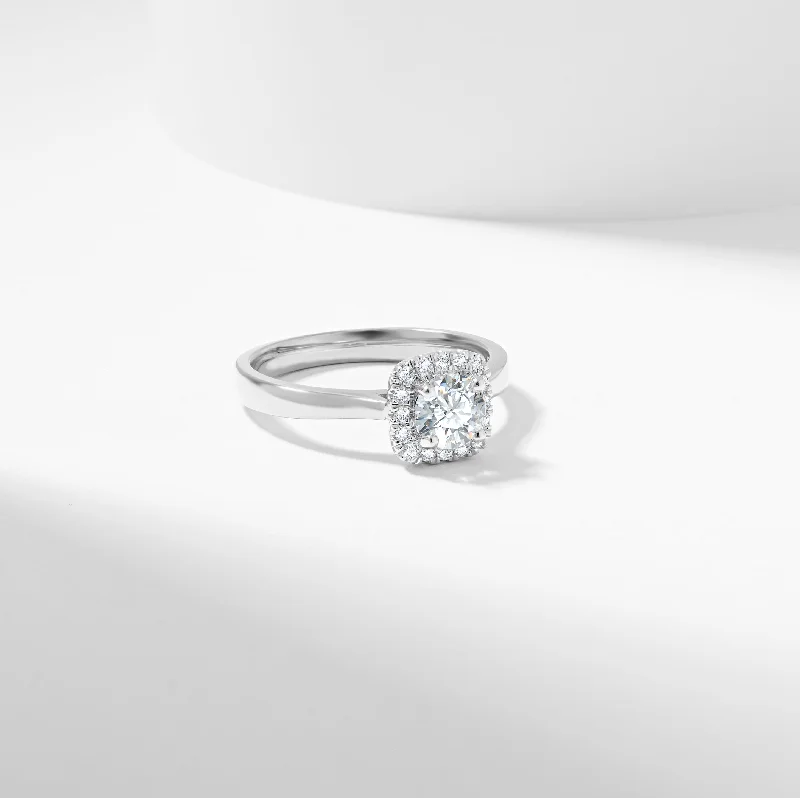 Round - cut diamond engagement ring with a twisted band design in 14K white goldRound Brilliant Diamond Halo Engagement Ring 0.73tdw Round - cut diamond engagement ring with a twisted band design in 14K white goldRound Brilliant Diamond Halo Engagement Ring 0.73tdw