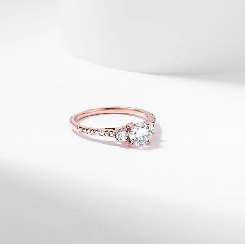 Ruby and diamond engagement ring with a halo of diamonds in 14K red goldRound Brilliant Lab Grown Diamond Trilogy Engagement Ring 1.0tdw Ruby and diamond engagement ring with a halo of diamonds in 14K red goldRound Brilliant Lab Grown Diamond Trilogy Engagement Ring 1.0tdw