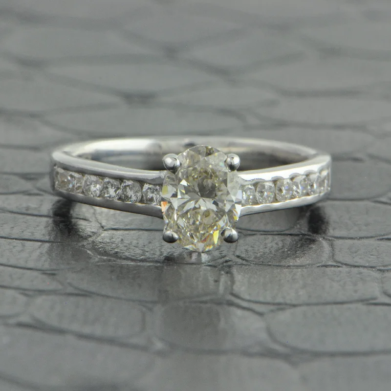 Oval - cut sapphire and diamond engagement ring in 18K white gold.99 ct. Oval Cut Diamond Engagement Ring in 18k White Gold Oval - cut sapphire and diamond engagement ring in 18K white gold.99 ct. Oval Cut Diamond Engagement Ring in 18k White Gold