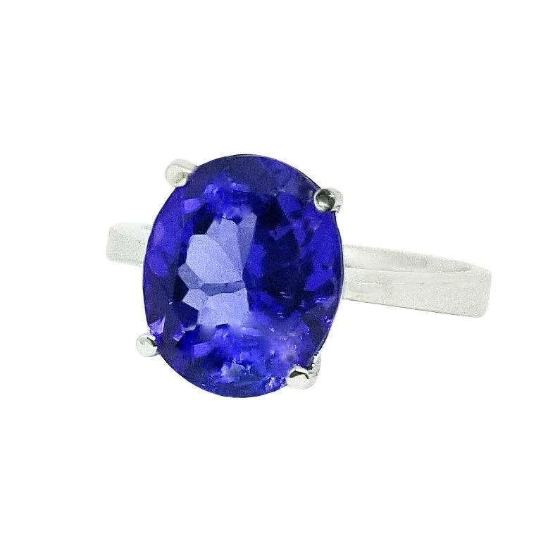 Interlocking Band Women's Rings in White Gold for a Modern DesignWhite Gold and Oval Tanzanite Ring Interlocking Band Women's Rings in White Gold for a Modern DesignWhite Gold and Oval Tanzanite Ring