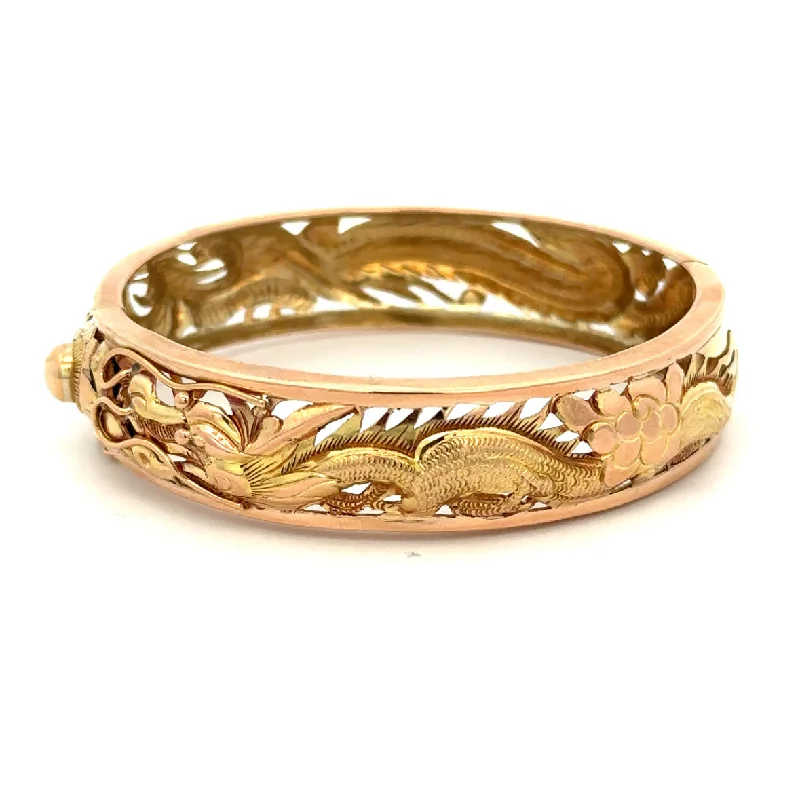 Halo diamond engagement ring in 18K white gold with a center oval - cut stoneTwo Tone Hinged Open Work Dragon Bracelet Halo diamond engagement ring in 18K white gold with a center oval - cut stoneTwo Tone Hinged Open Work Dragon Bracelet